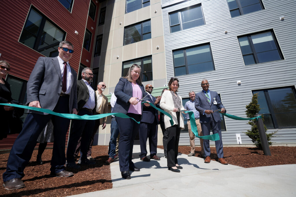 Ribbon cutting at new apartment building.