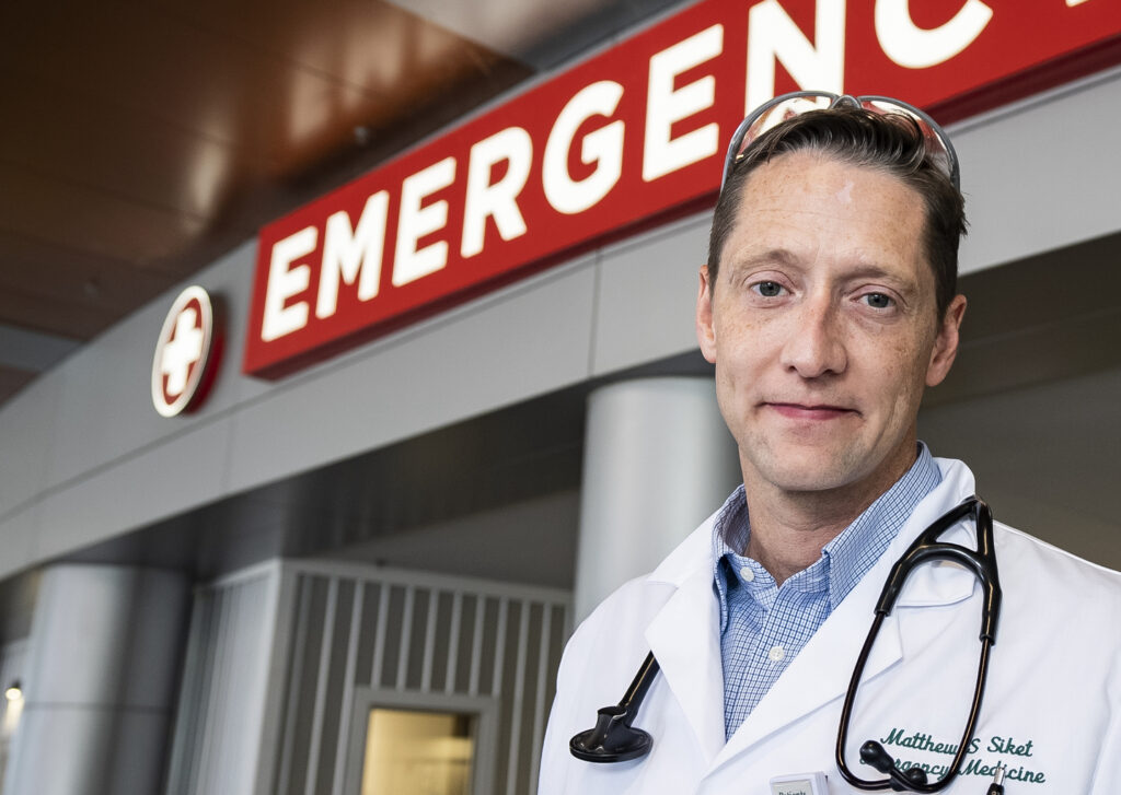 Matthew Siket, MD, standing outside the Emergency Department at the University of Vermont Medical Center.